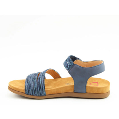 Side view of a women's Heavenly Feet Tyra sandal in navy blue with two front straps, ankle strap and a tan coloured sole.