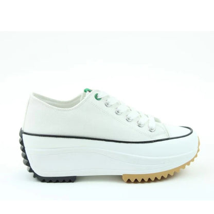Side view of a Heavenly Feet womens Strata white lace up canvas shoe with white platform sole.