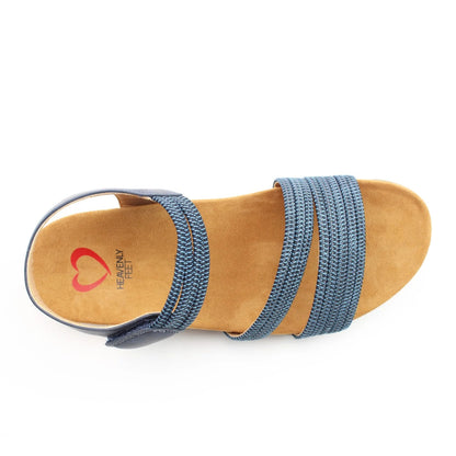 Top view of a women's Heavenly Feet Tyra sandal in navy blue with two front straps, adjustable ankle strap and a tan coloured sole.