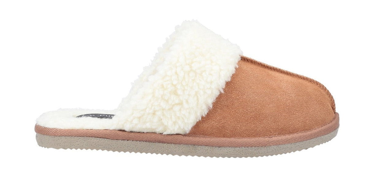 Side view of a Hush Puppies womens Arianna mule slipper in tan brown with faux fur lining.