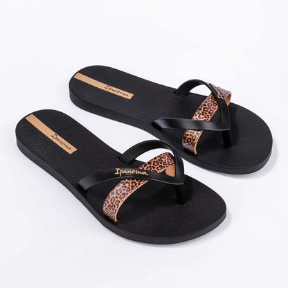 Main front view of a pair of women's Ipanema Kirei flip flops, a three strap toepost design in black with a contrasting leopard print strap.