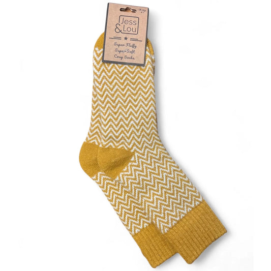 Jess and Lou womens gold yellow herringbone pattern wool socks on a white background.