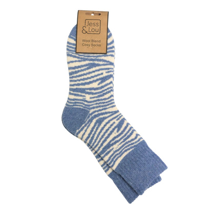 Main top view of a pair of womens Jess and Lou cosy wool-blend socks in blue zebra print.