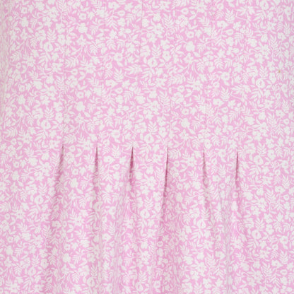 Close-up view the front pleats of a womens Lazy Jacks short sleeve LJ116 tunic in pink with a white ditsy floral pattern