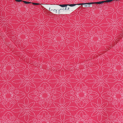 Close-up view of the scoop neckline and geometric pattern of a womens Lazy Jacks short sleeve LJ118 tunic in dark pink.