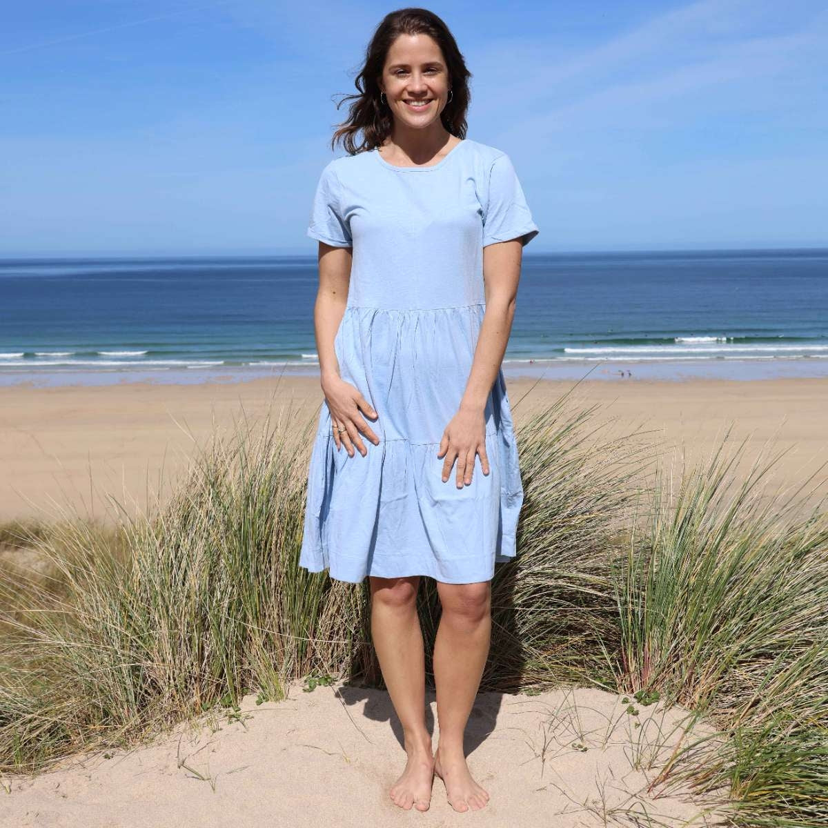 Woman wearing a Lazy Jacks LJ524 short sleeve tiered dress in sky blue.