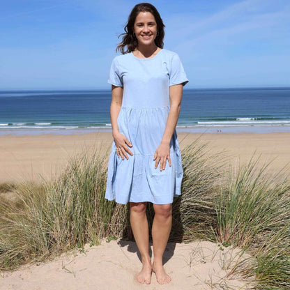 Woman wearing a Lazy Jacks LJ524 short sleeve tiered dress in sky blue.
