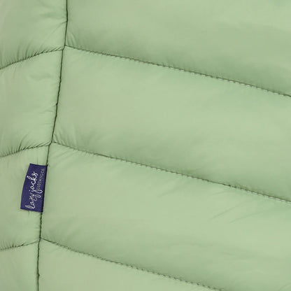 Close-up view of a side seam logo label of a womens Lazy Jacks GL2 lightweight padded gilet in Grass Green.