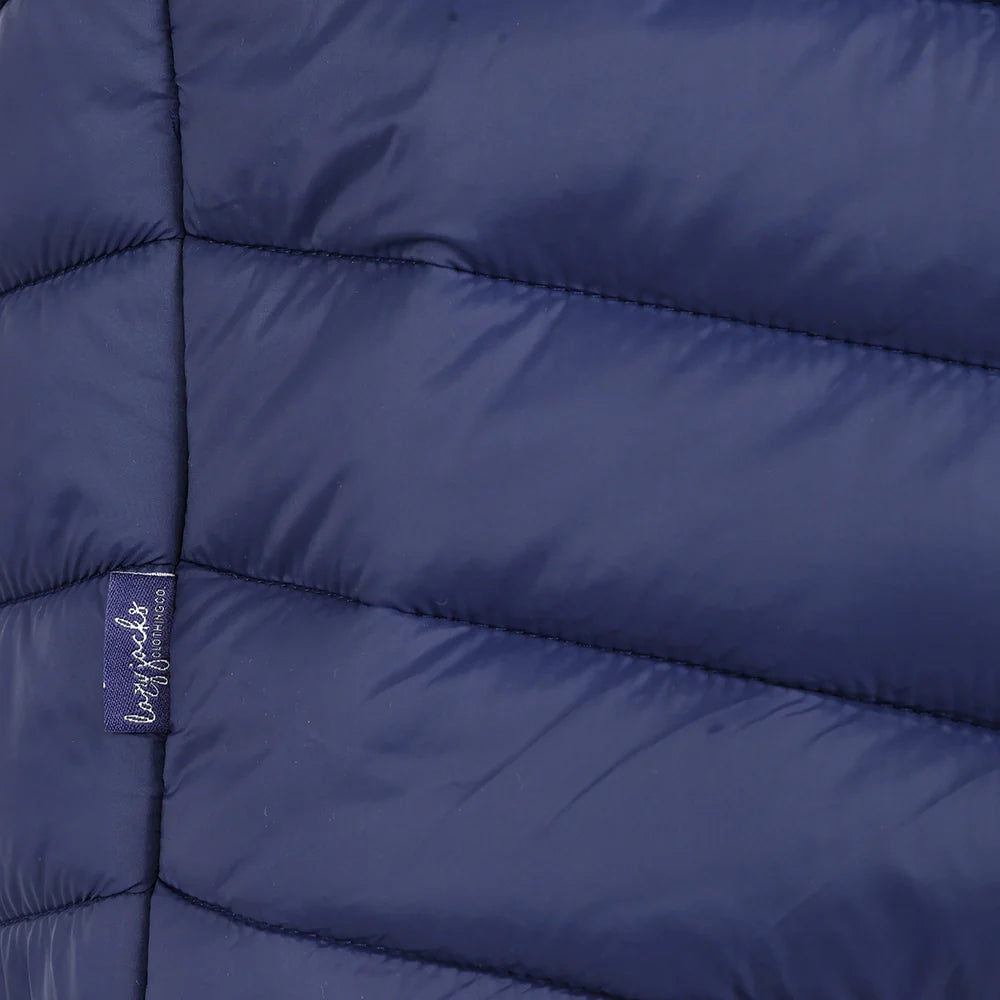 Close-up view of a side seam logo label of a womens Lazy Jacks GL2 lightweight padded gilet in Twilight Navy.