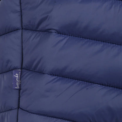 Close-up view of a side seam logo label of a womens Lazy Jacks GL2 lightweight padded gilet in Twilight Navy.