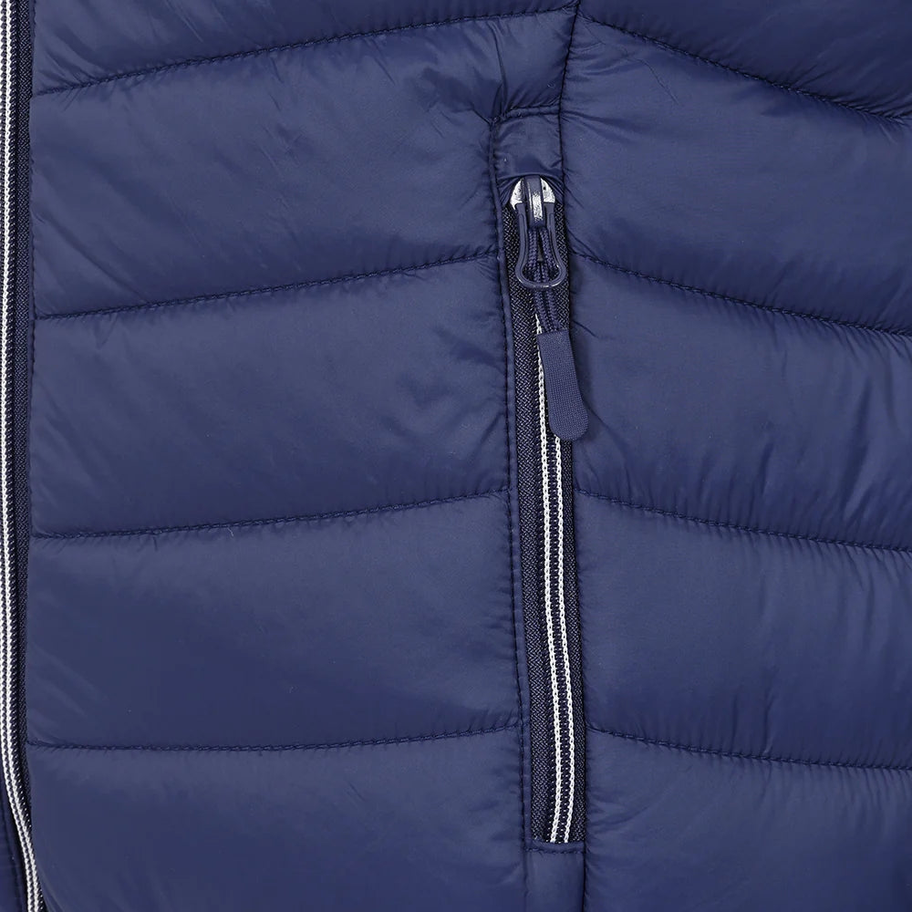 Close-up view of a zip pocket on a womens Lazy Jacks GL2 lightweight padded gilet in Twilight Navy.