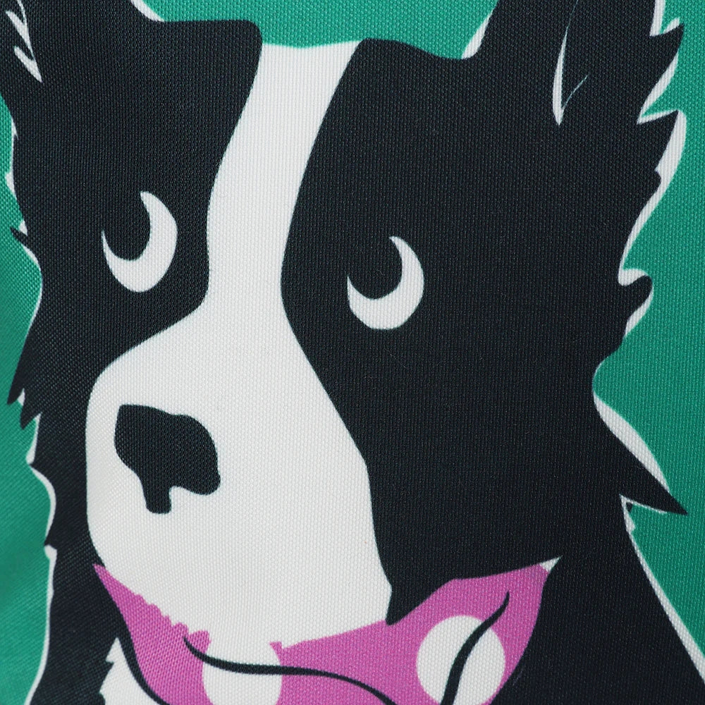 Close-up of Lazy Jacks green sheep dog bag featuring a black and white dog illustration on green background