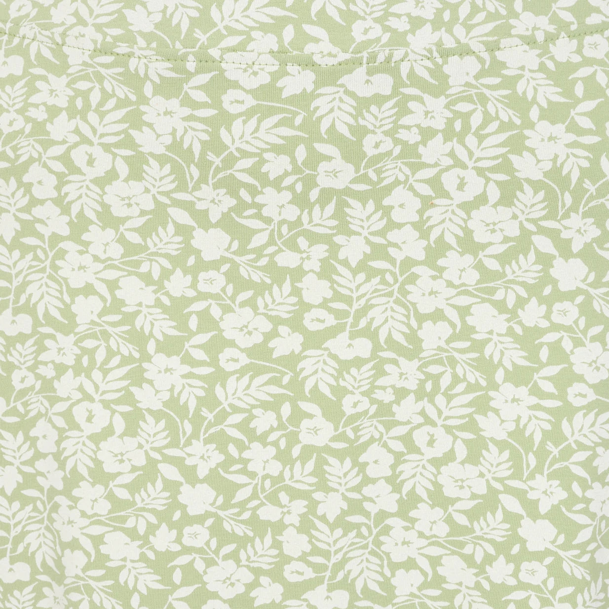 Close-up view of the grass green and white floral pattern of a women's Lazy Jacks LJ41 jersey skirt.
