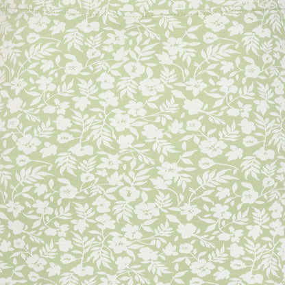 Close-up view of the grass green and white floral print of a women's Lazy Jacks LJ41 jersey skirt.