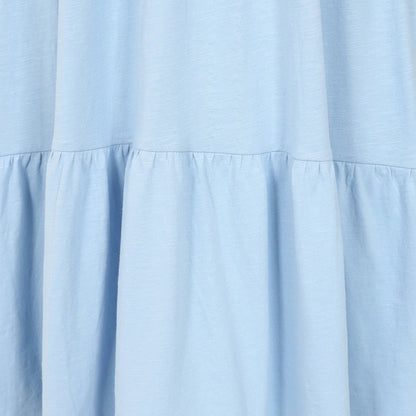 Close-up view of the tiered fabric of a Lazy Jacks LJ524 short sleeve dress in sky blue.