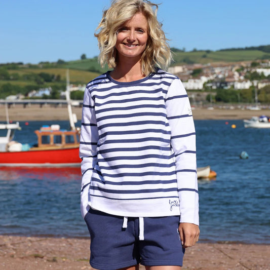 Front view of a woman wearing a Lazy Jacks LJ131S stripe crew neck sweatshirt in white and navy.