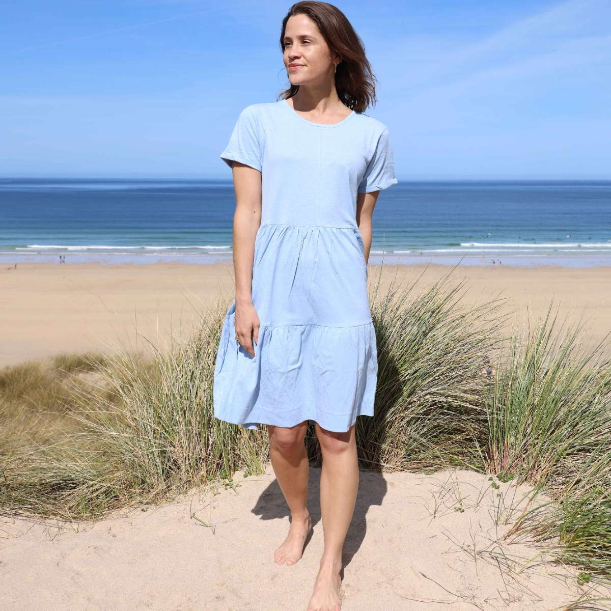 Front view of a woman wearing a Lazy Jacks LJ524 short sleeve tiered dress in sky blue.