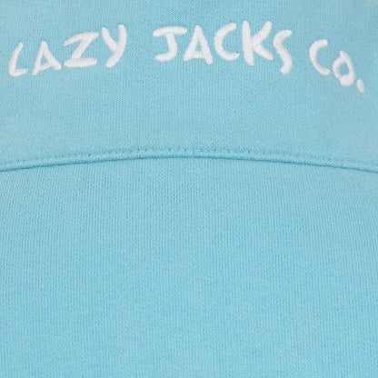 Close-up of light blue fabric with Lazy Jacks Co logo on Lazy Jacks womens zip sweatshirt spearmint