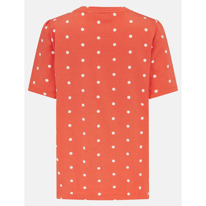 Back view of a womens Lighthouse short sleeve Ariana v-neck t-shirt in coral with a white dot pattern.