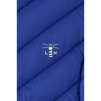 Close-up view of a the padded fabric and printed logo on a Lighthouse padded Laurel Gilet in Indigo Blue.
