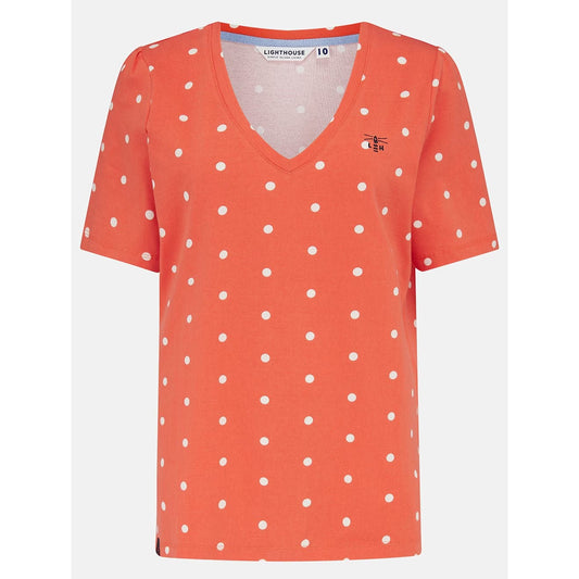 Front view of a womens Lighthouse short sleeve Ariana v-neck t-shirt in coral with a white dot pattern.