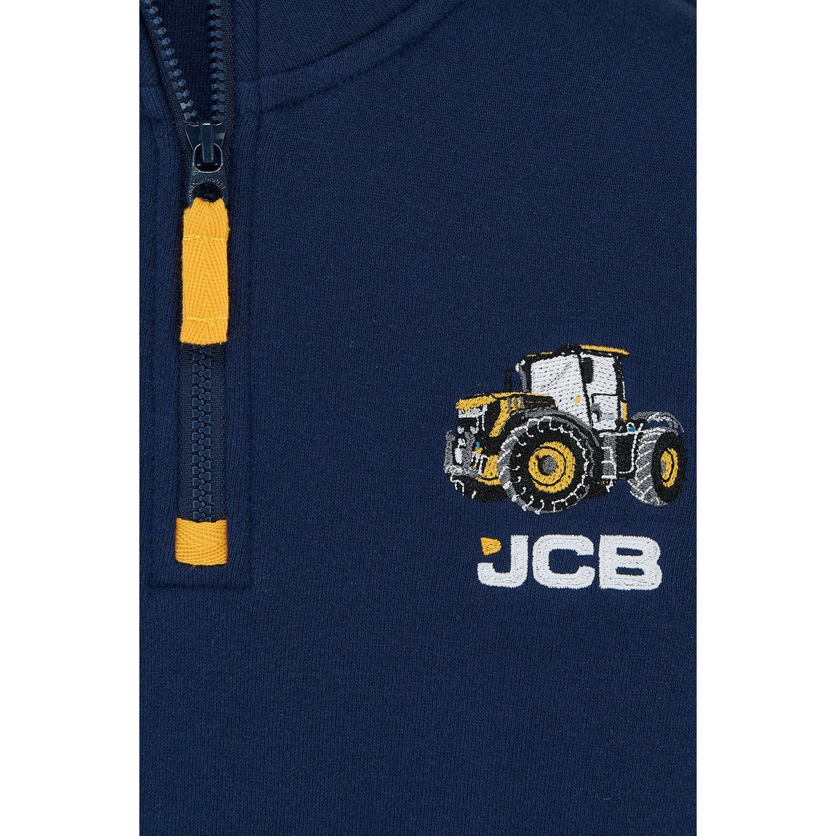 Close-up view of a Lighthouse kids Jonah 1/4 zip sweatshirt in navy with yellow trim and a JCB applique sewn on the chest.