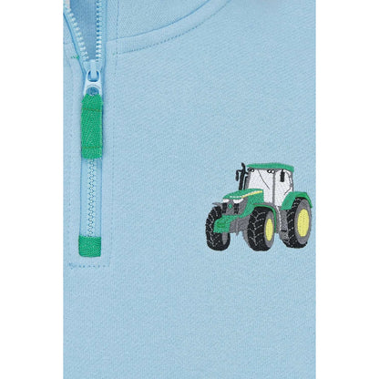 Close-up view of a Lighthouse Jonah zip neck sweatshirt in sky blue with green trim and tractor applique on the chest.