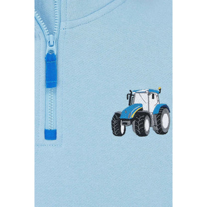 Close-up view of a Weird Fish kids Jonah 1/4 zip neck sweatshirt with blue trim and blue tractor applique sewn on the chest.