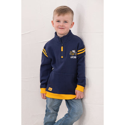 Front view of a boy wearing a Lighthouse Jonah 1/4 zip sweatshirt in navy with yellow trim and a JCB applique sewn on the chest.
