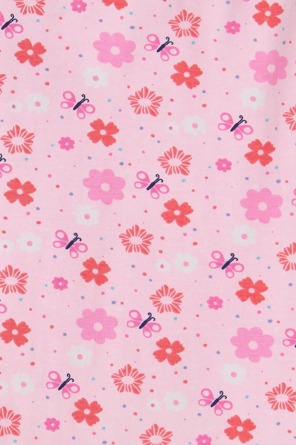 Lighthouse Kids pink floral leggings with red and pink flowers and small scissor patterns on light pink fabric