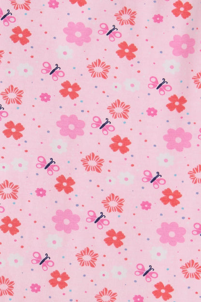Lighthouse Kids pink floral leggings with red and pink flowers and small scissor patterns on light pink fabric