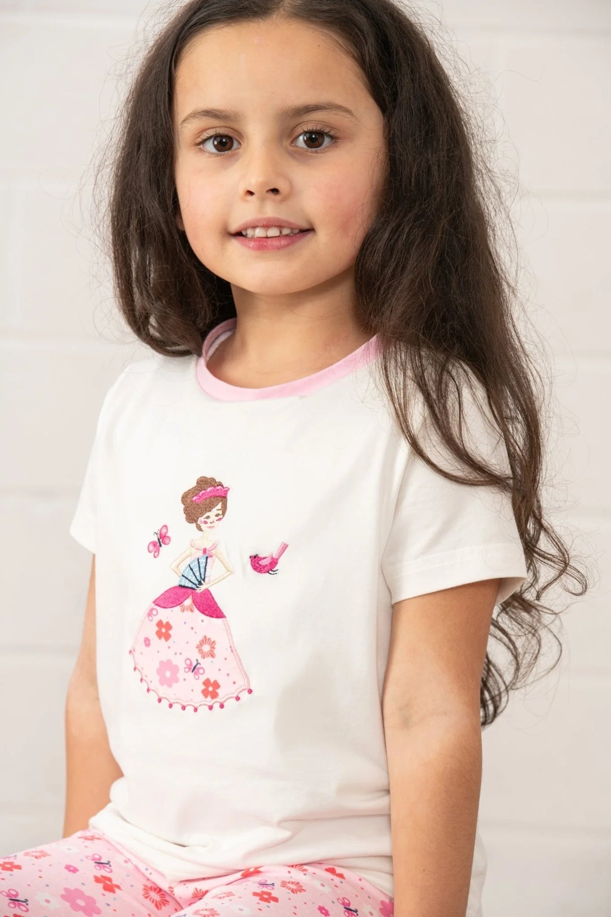 Lighthouse kids Princess Tee white t-shirt with pink collar and princess graphic worn by young girl