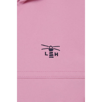 Close-up view of the embroidered logo and fabric of a womens Beachcomber II waterproof jacket in Pink.