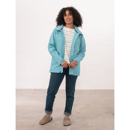 A woman wearing a Beachcomber II waterproof jacket in Blue unzipped.