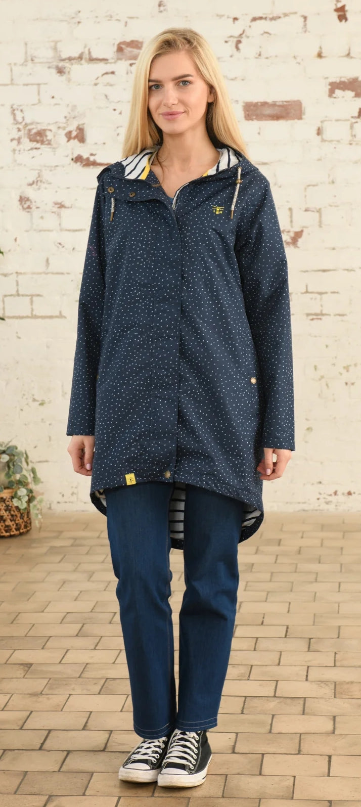 Lighthouse womens beachcomber jacket navy dot with hood and front pockets worn by model