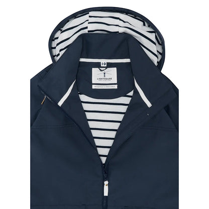 Close-up view of the striped lining of a women's Lighthouse Beachcomber II waterproof jacket in Navy.