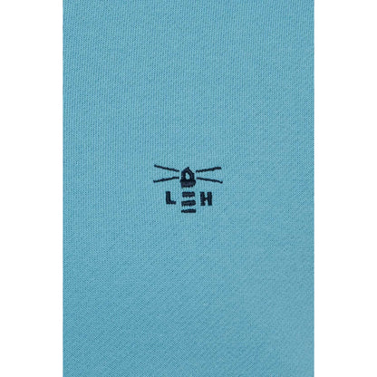 Close-up view of the embroidered logo of a Lighthouse women's Seaside crew neck sweatshirt in blue.