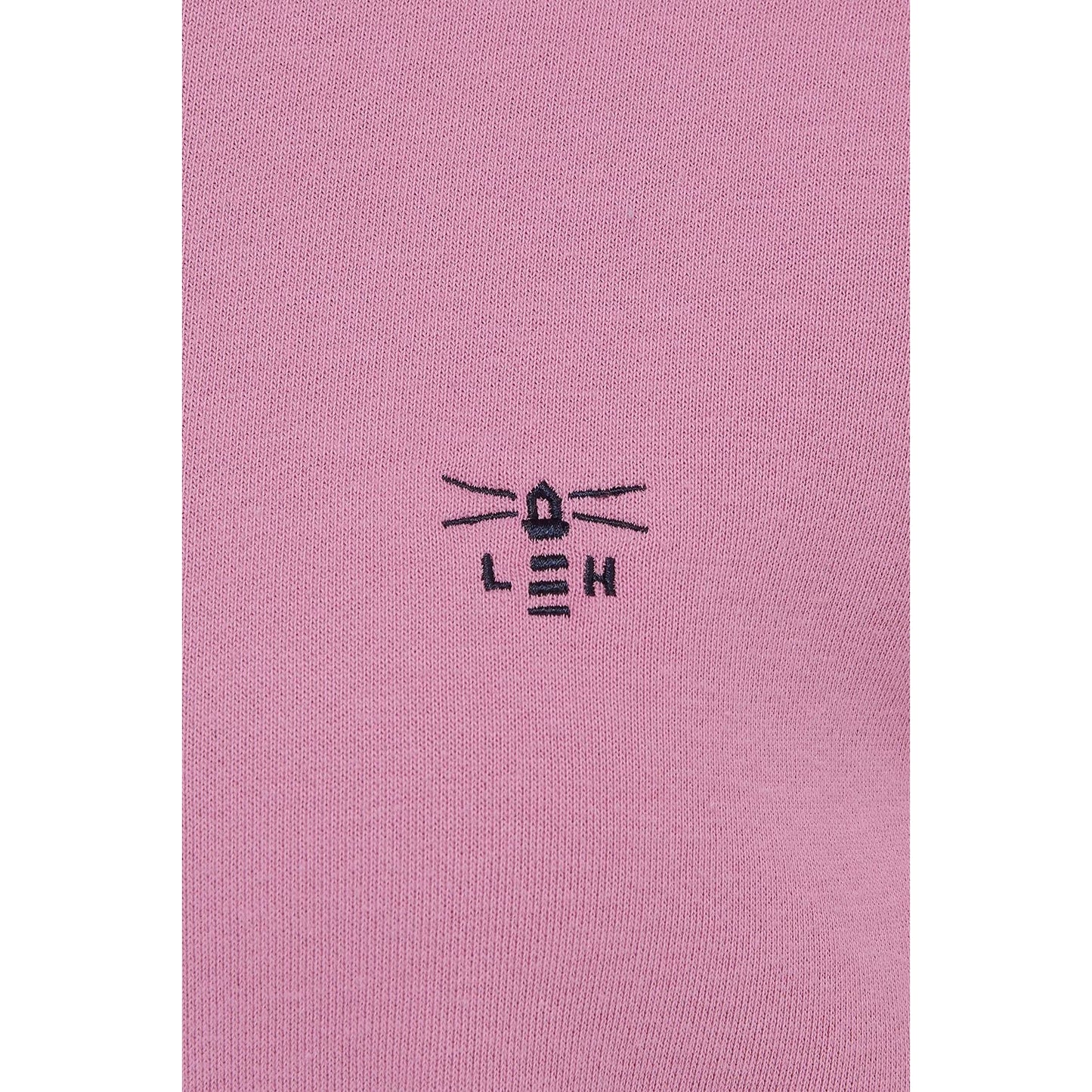 Close-up view of the embroidered logo of a Lighthouse women's Seaside crew neck sweatshirt in Pink.