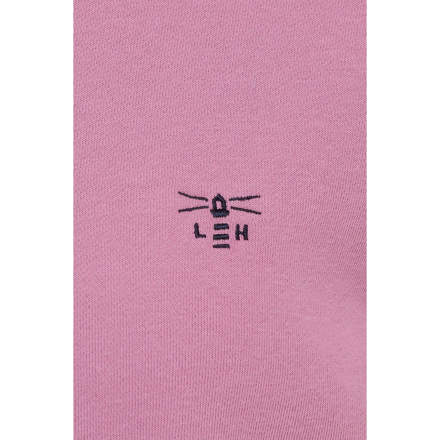 Close-up view of the embroidered logo of a Lighthouse women's Seaside crew neck sweatshirt in Pink.