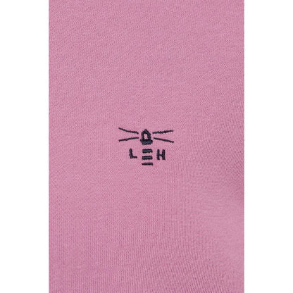 Close-up view of the embroidered logo of a Lighthouse women's Seaside crew neck sweatshirt in Pink.