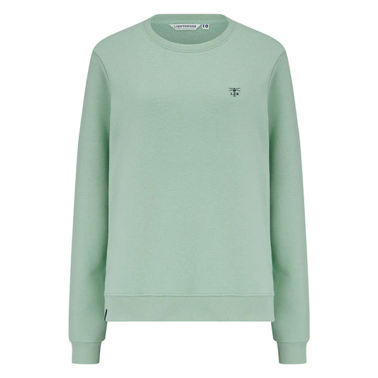 Main front view of a women's Lighthouse Seaside crew neck sweatshirt in Pastel Green.