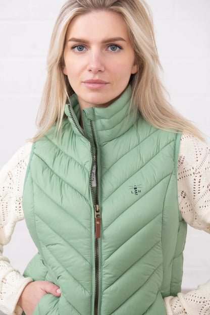 Lighthouse womens padded gilet green worn by woman with high collar and zip front