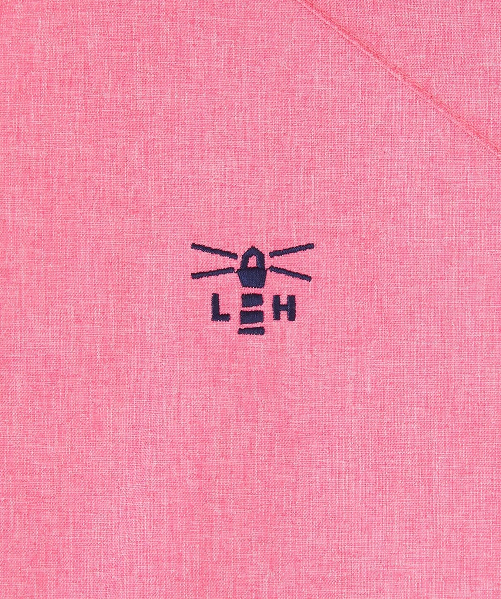 Close-up of Lighthouse womens pink waterproof jacket fabric with embroidered lighthouse logo