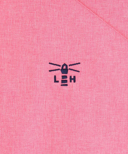 Close-up of Lighthouse womens pink waterproof jacket fabric with embroidered lighthouse logo