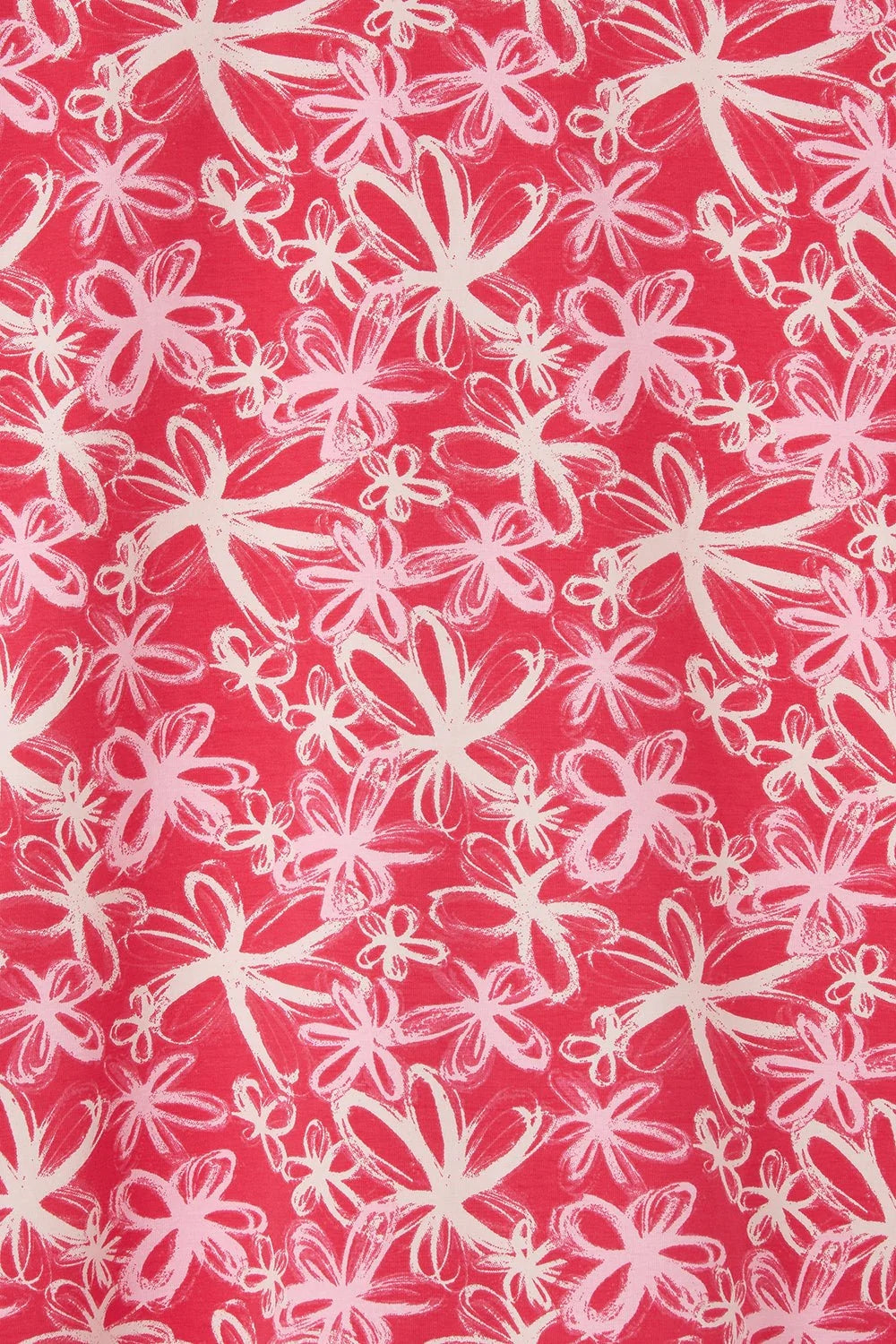 Close-up of Lighthouse womens Raspberry Floral Tee fabric with pink and white floral pattern on raspberry background