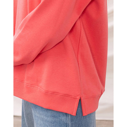 Coral womens Lighthouse sweatshirt with side hem slits on a white background