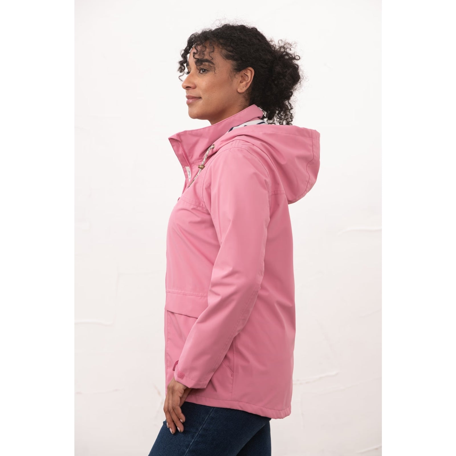 Side view of a womens Beachcomber II waterproof jacket in Pink.
