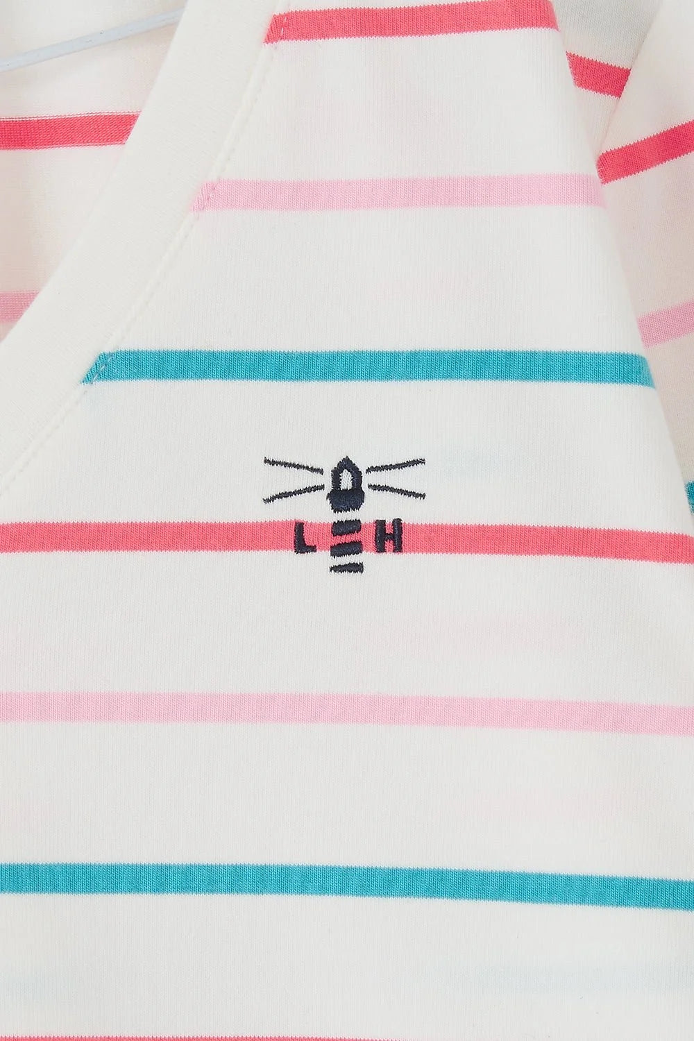 Lighthouse womens stripe v-neck top with white base and pink and teal horizontal stripes featuring embroidered lighthouse logo