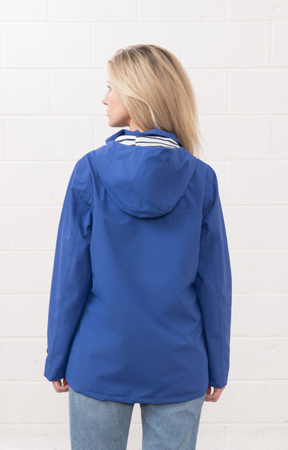 Back view of Lighthouse womens waterproof jacket in blue with hood and long sleeves