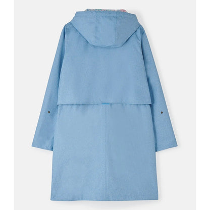Back view of a womens Lighthouse Pippa 3/4 length waterproof raincoat in Soft Denim Blue.